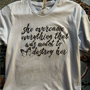 Light blue T-shirt with quote